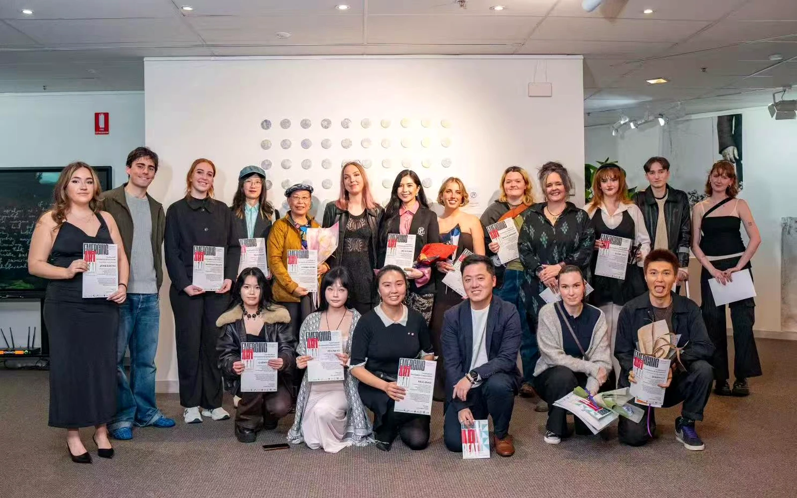 Participating artists and collaborators at the Emerging Art Beat 2025 opening